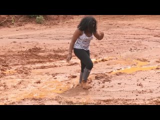 black girl in mud