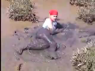 youtube - girl rolling in the mud