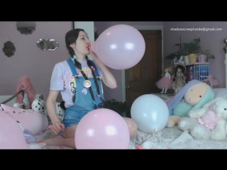 blowing up balloons