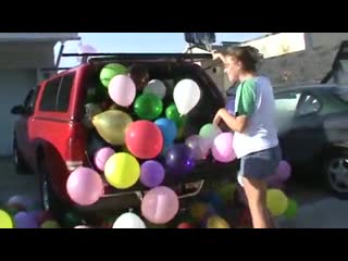 stomping to pop a car full of balloons making a huge mess